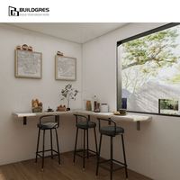 Cuisine sur mesure blanche en Australie, aménagement en L avec four et micro-ondes intégrés, conception modulaire pour la construction neuve en Nouvelle-Zélande