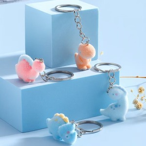 Porte-clés pendentif dinosaure mignon en résine, style dessin animé, mini animal jurassique, ornements modernes à suspendre pour sac - Product Image 1