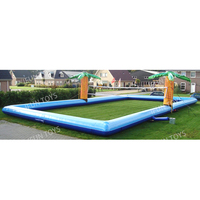 Jeu de sport en plein air volley-ball gonflable embarquement sur gazon palmier gonflable terrain de volley-ball de plage pour enfants et adultes