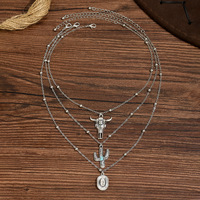 Collier ethnique style bohème western cowboy européen-américain avec perles noires incrustées en forme de riz AaaA et tête de taureau cactus