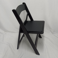 Chaise pliante rembourrée en résine PP noire empilable pour événements, vente en gros