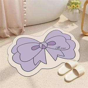 Alfombra de baño de tierra de diatomeas con forma de lazo, antideslizante y de secado rápido para baño - Product Image 1