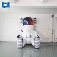 Modèle de dessin animé géant gonflable personnalisé d'un astronaute assis pour la publicité d'événements et festivals sur le thème de l'espace en extérieur, décoration gonflable