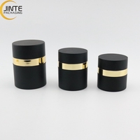 Flacon pompe airless rond en plastique noir personnalisé de luxe pour crème et soins de la peau, 15 ml, 30 ml, 50 ml, vente en gros