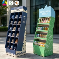 Présentoir de sol incliné en carton ondulé personnalisé, robuste, pliable, avec compartiments à double grille et étagères ouvertes pour la vente au détail de chapeaux et de boissons