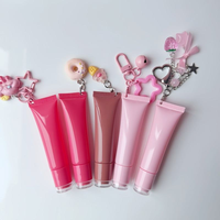 Tube à presser rose de 8g/15g de capacité Tube à lèvres brillant à lèvres vide crème à lèvres conteneur d'essence pour lèvres logo personnalisé pour emballage cosmétique