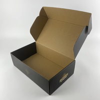 Boîte d'expédition noire élégante en carton ondulé mat de luxe avec logo personnalisé en feuille d'or pour petites entreprises et emballages artistiques, vente en gros