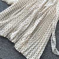 Ensemble jupe mi-longue plissée et haut à volants à pois élégant pour femme, idéal pour les tenues décontractées et les trajets quotidiens