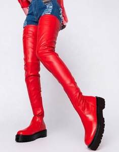 Bottes hautes pour femmes à semelle épaisse, design tendance, en cuir extensible, au-dessus du genou, couleur rouge, plates - Product Image 1