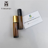 Flacon de parfum rond en verre rose de 10 ml pour huiles essentielles avec impression sérigraphique, estampage doré, logo personnalisé, rouleau métallique
