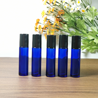 Vente en gros de flacons en verre ronds bleus vides de 10 ml pour huiles essentielles avec bille roulante en métal