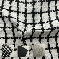 Tissu en tweed de polyester teint en fil noir et blanc à carreaux de haute qualité pour vêtements