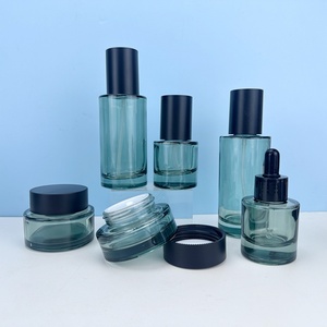 ขวดแก้วใสทรงกลมไหล่แบนสำหรับน้ำมันใส่ผม เซรั่มเครื่องสำอาง ขนาด 30 มล. 50 มล. 100 มล. พร้อมหัวปั๊มหยดและโลโก้สั่งทำได้ - Product Image 1