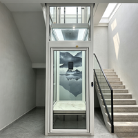 Ascenseur hydraulique résidentiel moderne et confortable avec cabine en verre au design minimaliste et options de revêtement de sol en granit, PVC ou marbre