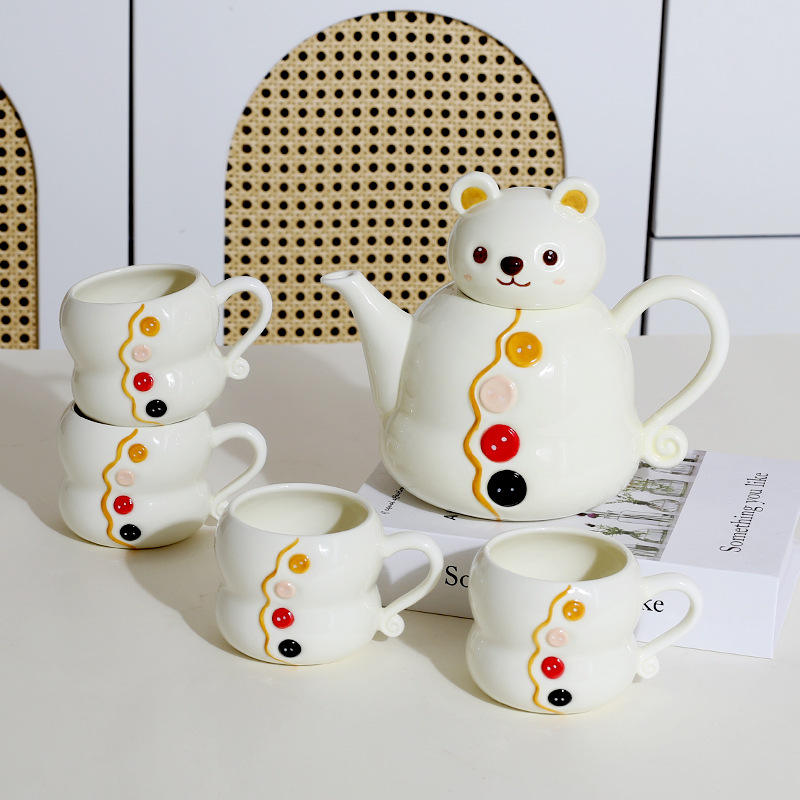 Juego de tetera y taza de té blanco