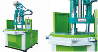 Machine de moulage par injection verticale à table rotative pour l'insertion de composants électroniques (transistors et puces)