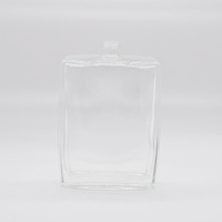 Flacon de parfum rectangulaire transparent en verre Fairy FR109 100ml au design moderne avec couvercle doré, pulvérisateur à pompe et finition estampée à chaud