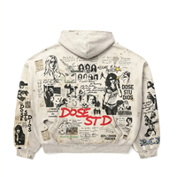 Sweat à capuche oversize gris clair délavé style vintage, imprimé graphique intégral effet collage, streetwear, avec détails usés