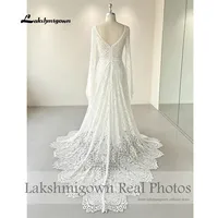 Robe de mariée bohème grande taille en dentelle à col en V et manches évasées Lakshmigown, dos ouvert