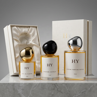 Flacon vaporisateur de parfum en verre cylindrique minimaliste 30ml 50ml 100ml personnalisable avec bouchon en forme de pierre