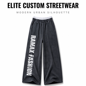 Pantalon de survêtement personnalisé pour homme, délavé aux pigments, avec double ceinture, imprimé lettres verticales effet usé, poches latérales, coupe ample et jambe large - Product Image 1