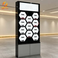 Support d'affichage élégant pour lunettes de soleil noires, avec éclairage LED hexagonal pour magasin d'optique