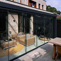 Porte pliante coulissante en verre trempé sans cadre pour véranda extérieure Design pliant avec panneau vitré