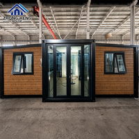Casa Contenedor Expandible Moderna con Paneles de Madera Marrón, Estructura de Acero Negro, Puerta Doble de Vidrio y Ventanas Abatibles, Casa Prefabricada