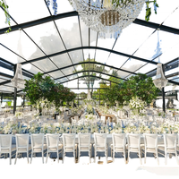Tente de réception de luxe TENTCHO en aluminium personnalisée avec toit transparent en verre et parois claires pour mariages et événements en plein air