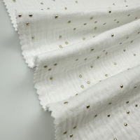 Tissu en coton biologique double crêpe imprimé à motifs croisés pour bébés et enfants