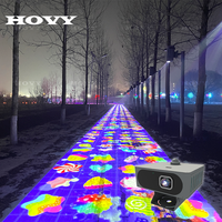 Projection LED interactive multicolore pour sol, portable et légère, idéale pour les événements en plein air et les aires de jeux pour enfants.