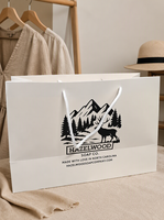 Sacs en papier blanc en gros avec logo personnalisé, sacs en papier d'emballage pour boutique de vêtements