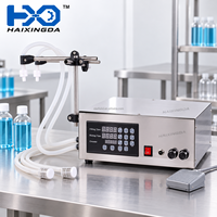 Machine de remplissage semi-automatique à double tête pour liquides, eau, boissons, jus, emballage de bouteilles en plastique et petite ligne de production