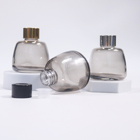 Vente en gros de flacons diffuseurs en verre givré gris mat de 100 ml avec bouchon à vis et impression sérigraphique pour parfum d'intérieur