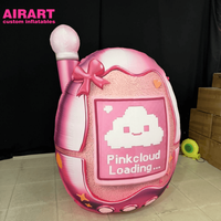Modèle de téléphone gonflable rose de dessin animé pour accessoires promotionnels accrocheurs pour centres commerciaux, accessoire Tamagotchi gonflable personnalisé imprimé
