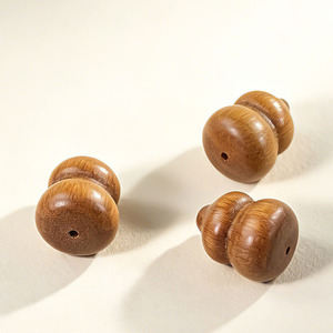 ลูกปัดไม้จันทน์ทรงกลมขนาด 16x19.5 มม. ลายไม้ สำหรับทำสร้อยข้อมือ - Product Image 1