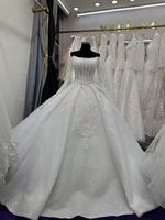 Nouvelle Arrivée 2026 – Robe de Mariée de Luxe Blanche en Dentelle Perlée avec Manches Longues et Traîne Spectaculaire