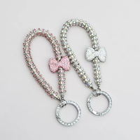 Saint-Valentin 2025 : Porte-clés de luxe avec nœud, anneau diamant anti-perte, bracelet en métal et pendentif pour téléphone portable pour femme