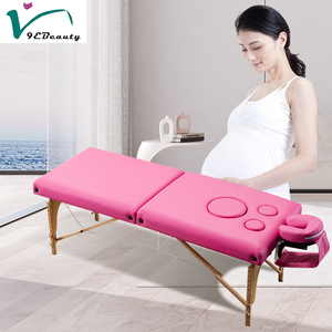 Lit de <span class=keywords><strong>massage</strong></span> pliable multifonctionnel à 2 sections en bois <span class=keywords><strong>pour</strong></span> femmes enceintes Salon commercial Utilisation dans un salon - Product Image 2