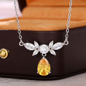 Collana con pendente a forma di fiore placcato in argento con pietra di zirconia cubica gialla per donna, da indossare per feste, catena in lega stile classico - Product Image 1