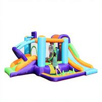Château gonflable géant commercial multi-pistes avec toboggans et piscine à balles, combo gonflable en PVC violet et vert pour location de fêtes d'enfants