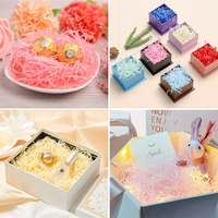 Papier de remplissage froissé coloré 17 g/m² en gros, raphia et herbe de lafite coupés pour emballer et décorer les cadeaux