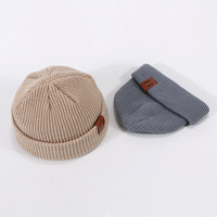 Vente en gros usine – Bonnets d'hiver en acrylique tricoté avec patch en cuir jacquard personnalisé, motif personnage de dessin animé, logo sur mesure