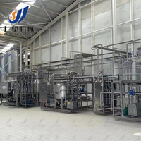 Ligne de production rentable de jus de mangue naturelle Usine de traitement de fruits entièrement automatique avec système de pasteurisation et de remplissage