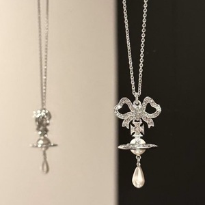 Nouveauté été : Collier de luxe abordable pour femme, style Western, en tungstène plaqué or, avec pendentif Orb Planète, nœud, goutte d'eau et perle - Product Image 3