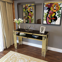 Table console moderne de luxe avec base en acier inoxydable doré et miroir en verre pour la maison ou l'hôtel