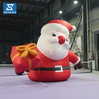 Père Noël gonflable géant personnalisé pour la décoration de centres commerciaux en plein air lors des événements de Noël