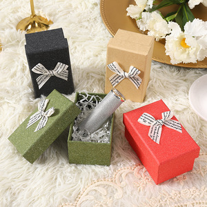 Boîtes rigides personnalisées pour bijoux et parfums, fabriquées par Nicro Original Factory, avec doublure en éponge, ruban et nœud, en carton écologique. - Product Image 1