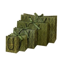 Sac en papier doré élégant, sac fourre-tout vert olive sophistiqué, ruban décoratif porte-bonheur, porte-cadeau luxueux