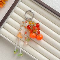 Porte-clés esthétique mignon en forme de fruit, fait main, perlé, avec pompon floral, kaki, cerise, muguet, pendentif pour sac ou téléphone